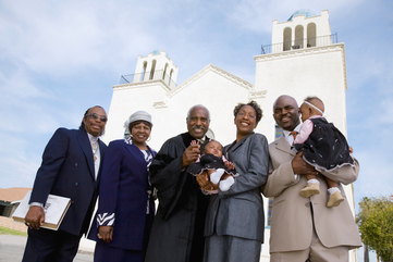 African family in front of church